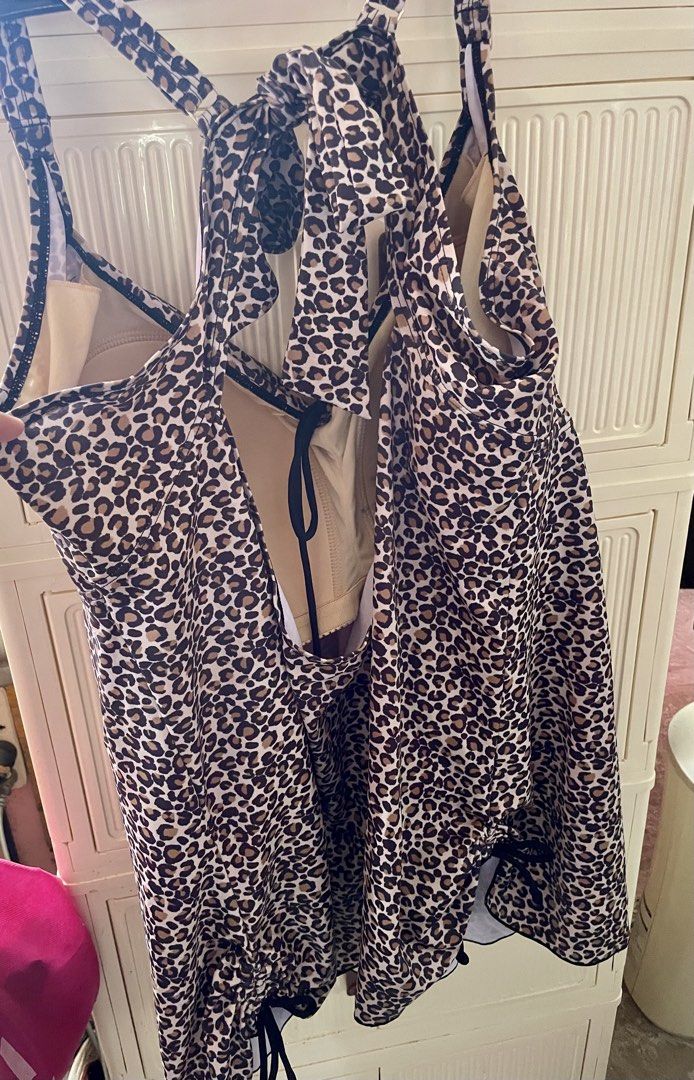 plus size swimwear dress (Category: Bikinis & Swimsuits) located in Cainta. Submitted by cof.fee (Listing ID 1469182065, Image 3). Description: - Trendy leopard print design - Adjustable halter straps and side drawstrings for a custom fit - Flattering gathered fabric with stylish center ring accent - Built-in padded cups for comfort and support - Versatile piece that pairs easily with black bottoms.