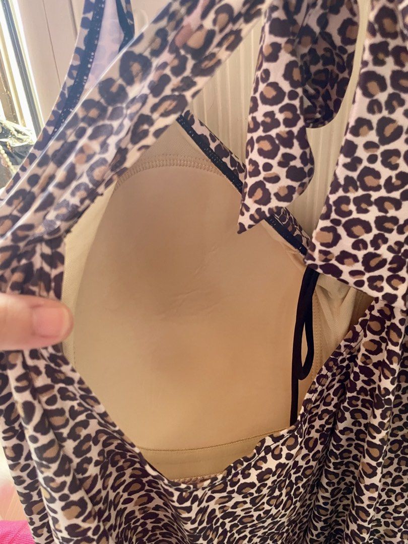 plus size swimwear dress (Category: Bikinis & Swimsuits) located in Cainta. Submitted by cof.fee (Listing ID 1469182065, Image 2). Description: - Trendy leopard print design - Adjustable halter straps and side drawstrings for a custom fit - Flattering gathered fabric with stylish center ring accent - Built-in padded cups for comfort and support - Versatile piece that pairs easily with black bottoms.