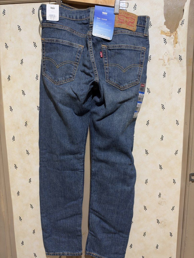 Levi's 502 Taper Stretch Jeans 29x30 (Category: Jeans) located in Makati City. Submitted by heyrods (Listing ID 1469203234, Image 2). Description: - Brand: Levi's 502 Taper Jeans - Condition: Brand new with original tags attached - Size: W29 x L30 - Color: Medium wash blue denim - Fabric: Cool performance stretch, lightweight, and breathable - Fit: Sits below waist, regular through thigh, tapered leg.