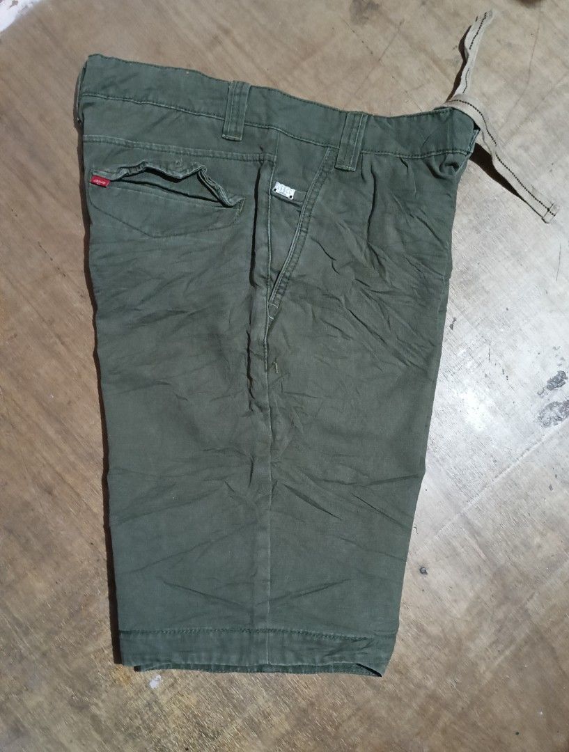 Levi's Olive Green Shorts with Drawstring (Category: Shorts) located in Manila. Submitted by sweety_skwert (Listing ID 1469223281, Image 3). Description: - Brand: Levi's - Color: Olive Green - Material: Durable 100% cotton - Waistband: Built-in drawstring for an adjustable, comfortable fit - Pockets: Functional back pockets with secure button closures - Details: Signature red Levi's tab on the back pocket and subtle LS&Co metal hardware near the 