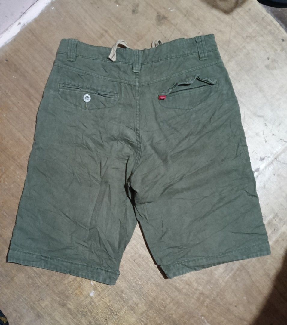 Levi's Olive Green Shorts with Drawstring (Category: Shorts) located in Manila. Submitted by sweety_skwert (Listing ID 1469223281, Image 2). Description: - Brand: Levi's - Color: Olive Green - Material: Durable 100% cotton - Waistband: Built-in drawstring for an adjustable, comfortable fit - Pockets: Functional back pockets with secure button closures - Details: Signature red Levi's tab on the back pocket and subtle LS&Co metal hardware near the 