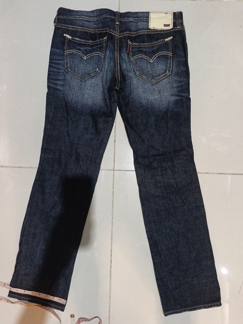 Levi's San Francisco Denim Jeans Size 28 (Category: Jeans) located in Davao. Submitted by romelyap (Listing ID 1469180621, Image 2). Description: - Brand: Levi's San Francisco - Style: Straight leg denim jeans - Color/Wash: Dark blue wash - Size: Tagged size 28 (inner waistband) - Details: Classic five-pocket setup, contrast stitching, branded hardware - Accents: Signature back pocket arcuate stitching and iconic red tab - Condition: Solid everyd