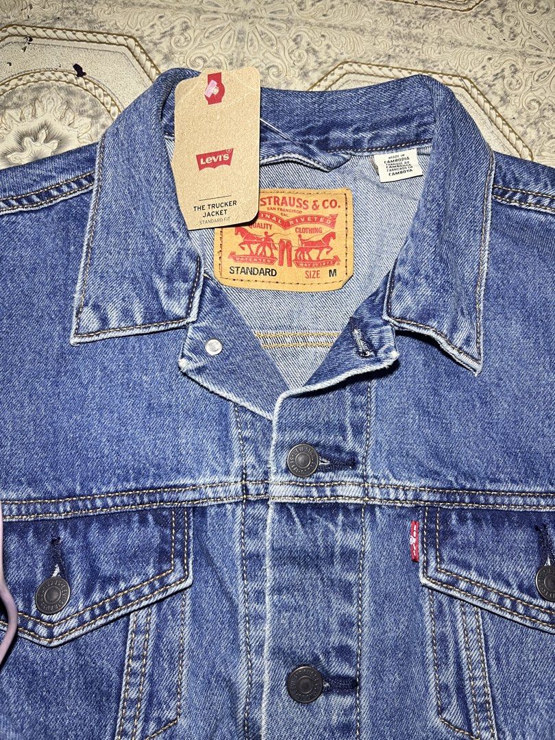 Levis Trucker Denim Jacket (Category: Coats, Jackets and Outerwear) located in Quezon City. Submitted by rnb-collection (Listing ID 1469198373, Image 2). Description: Forsale‼️ Levis Trucker Denim Jacket Standard Size Medium 26x23 Brand New with Hangtags No issue 3k+sf only 📍Quezon City Lalamove or J&T Express 🚚 📌Payment First Only, No cod, No cop Open for Videocall..
