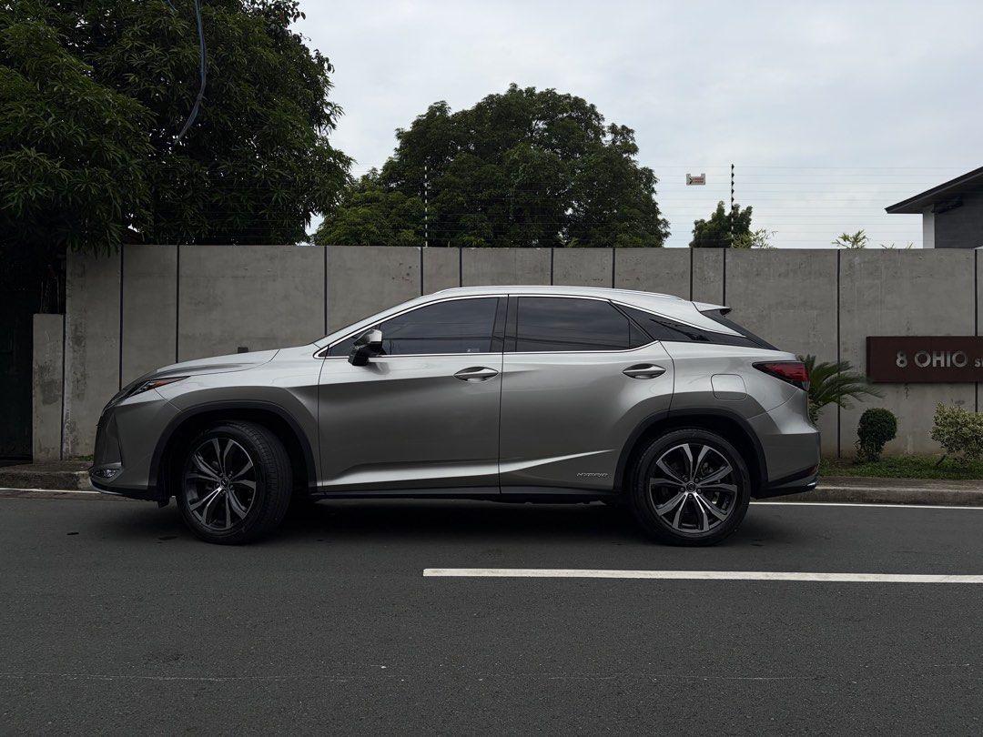 Lexus RX450h (A) (Category: Used Cars) located in Quezon City. Submitted by angeloco (Listing ID 1469169175, Image 2). Description: 2021 Lexus RX450h Hybrid AWD | 18,179 KM ₱3,300,000 Negotiable Not the cheapest RX450h, but one of the freshest you’ll find. ✓ Only 18,179 km ✓ Lexus casa maintained (Last PMS Jan 2026) ✓ No accident, flood, or mechanical issues ✓ Very clean inside and out ✓ Premium Lexus-installed 3M tint ✓ Green hybrid plate secure