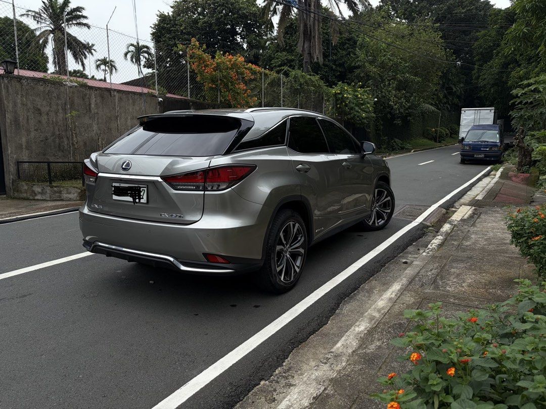Lexus RX450h (A) (Category: Used Cars) located in Quezon City. Submitted by angeloco (Listing ID 1469169175, Image 3). Description: 2021 Lexus RX450h Hybrid AWD | 18,179 KM ₱3,300,000 Negotiable Not the cheapest RX450h, but one of the freshest you’ll find. ✓ Only 18,179 km ✓ Lexus casa maintained (Last PMS Jan 2026) ✓ No accident, flood, or mechanical issues ✓ Very clean inside and out ✓ Premium Lexus-installed 3M tint ✓ Green hybrid plate secure