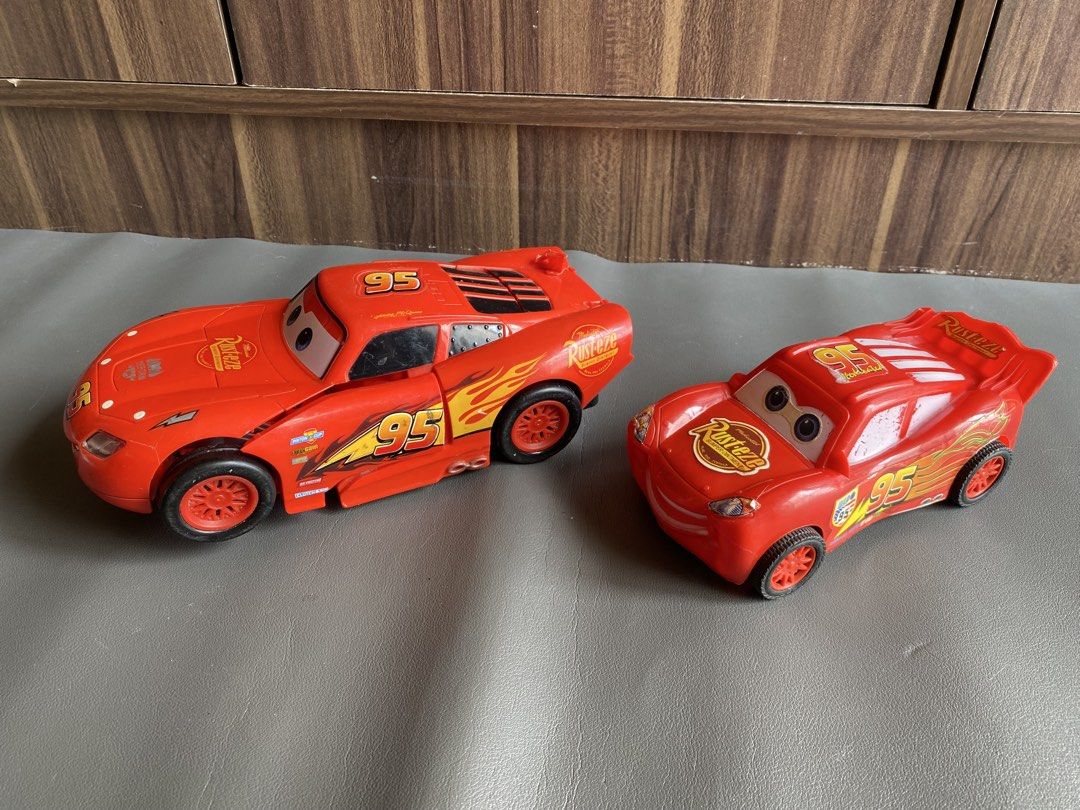 Lightning McQueen Transformers Cars 95 Toy (Category: Vehicle & Diecast Models) located in Manila. Submitted by declutterthingzzz (Listing ID 1469317979, Image 2). Description: - Lightning McQueen toy cars from Cars - 1 version transforms into a fun robot - Features iconic Number 95 decals and Rust-eze branding - Detailed plastic construction with standard wheels - Shows some minor wear from play - Great gift for kids and movie fans Plastic LM no