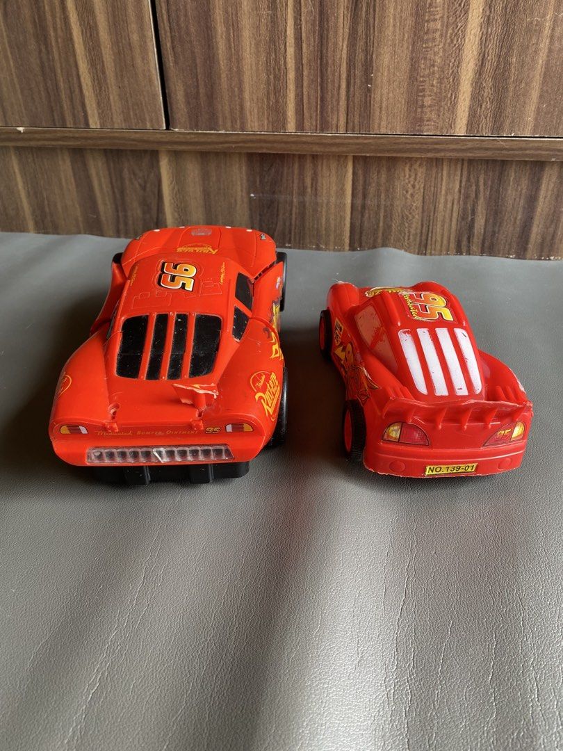 Lightning McQueen Transformers Cars 95 Toy (Category: Vehicle & Diecast Models) located in Manila. Submitted by declutterthingzzz (Listing ID 1469317979, Image 3). Description: - Lightning McQueen toy cars from Cars - 1 version transforms into a fun robot - Features iconic Number 95 decals and Rust-eze branding - Detailed plastic construction with standard wheels - Shows some minor wear from play - Great gift for kids and movie fans Plastic LM no