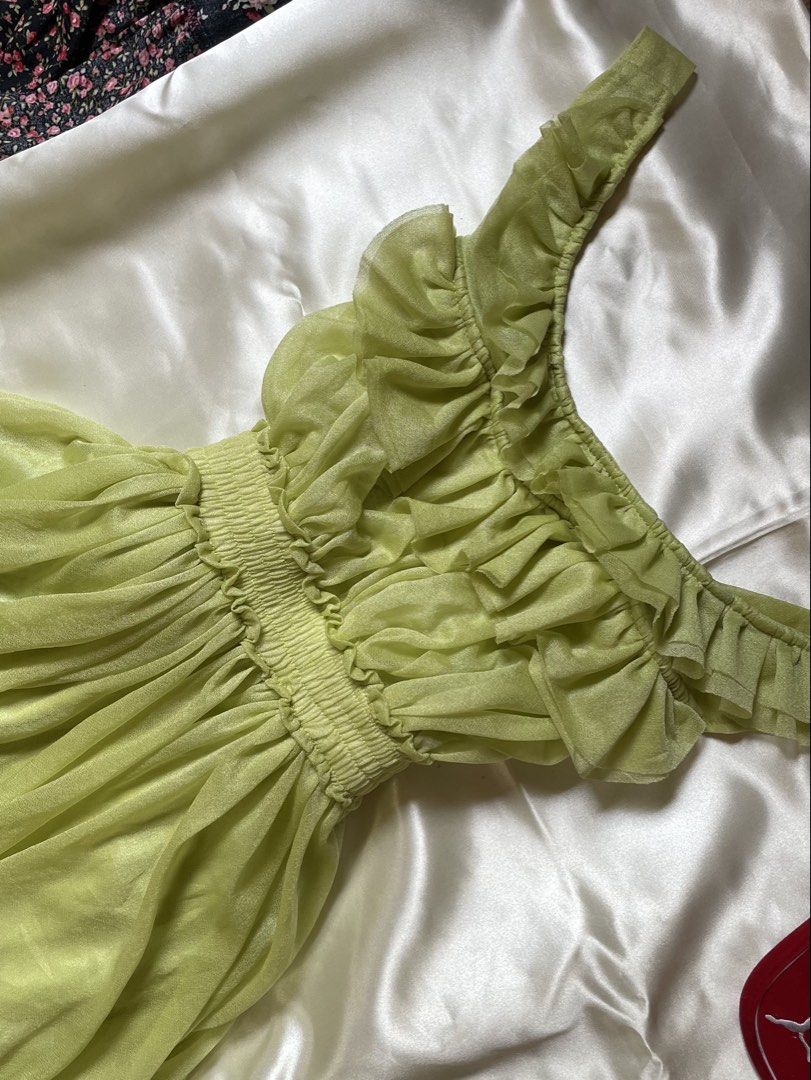Lime green maxi dress with ruffles (Category: Dresses) located in Caloocan City. Submitted by jai_jai00 (Listing ID 1469233349, Image 2). Description: - Color: Lime Green - Material: Sheer, lightweight fabric - Design: Ruffles on neckline and straps with a flowy maxi skirt - Fit: Stretchy, comfortable smocked elastic waist - Occasion: Ideal for warm weather, parties, and casual events - Condition: Great fit and very comfortable to wear.