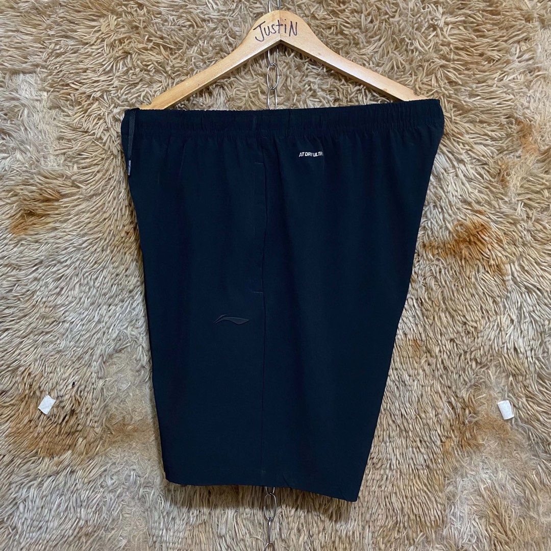 Li-Ning Black Athletic Shorts with Drawstring (Category: Shorts) located in Butuan. Submitted by jc13thrifts (Listing ID 1469341350, Image 2). Description: - Brand: Li-Ning - Color: Classic solid black - Fit: Elastic waistband with adjustable black drawstring and metal-tipped aglets - Storage: Convenient zippered side pockets to keep your phone and keys secure - Material: Lightweight performance fabric equipped with dry technology - Design: Minim