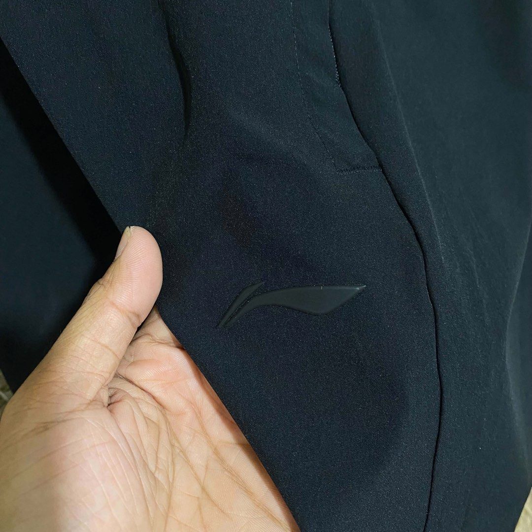 Li-Ning Black Athletic Shorts with Drawstring (Category: Shorts) located in Butuan. Submitted by jc13thrifts (Listing ID 1469341350, Image 3). Description: - Brand: Li-Ning - Color: Classic solid black - Fit: Elastic waistband with adjustable black drawstring and metal-tipped aglets - Storage: Convenient zippered side pockets to keep your phone and keys secure - Material: Lightweight performance fabric equipped with dry technology - Design: Minim