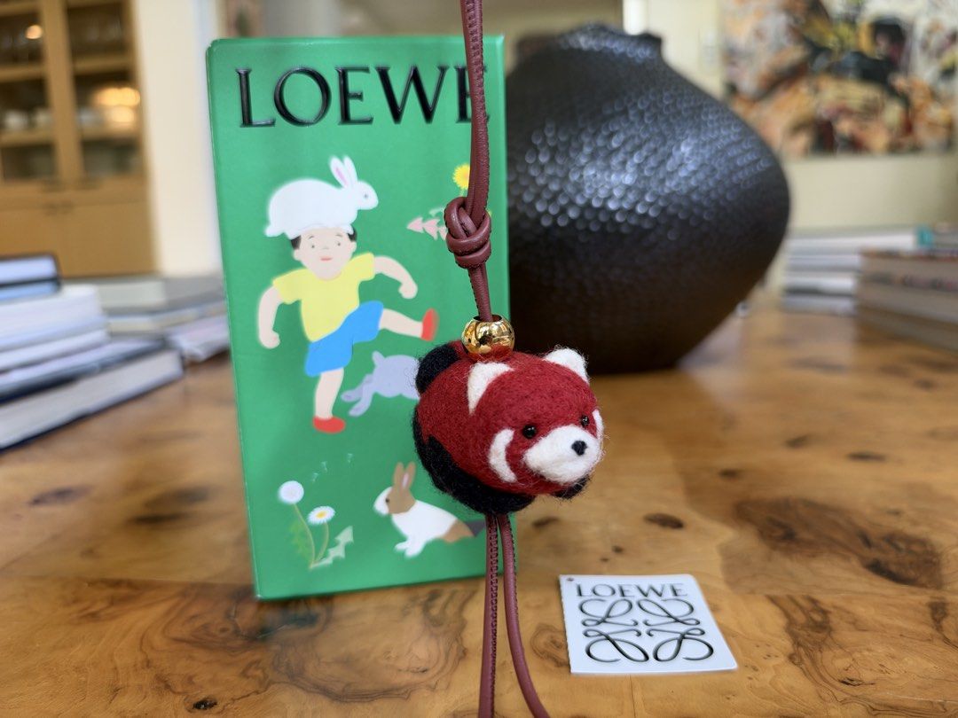 Loewe Red Panda Felt Charm (Category: Charms) located in Muntinlupa City. Submitted by katoshops (Listing ID 1469199980, Image 1). Description: Loewe Red Panda Felt Bag Charm Current Market Price: ₱29,300.00 Selling Price: ₱15,000.00 Condition: Excellent (10 /10) Reason for Selling: Bought a replacement bag charm. Don’t get to use this anymore. Additional Details: Color: Red, white, and black felt with gold hardware and reddish brown leather Worn
