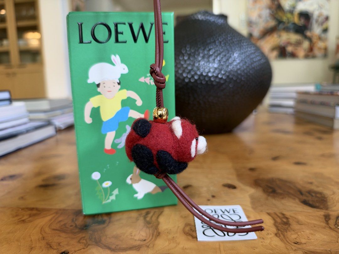 Loewe Red Panda Felt Charm (Category: Charms) located in Muntinlupa City. Submitted by katoshops (Listing ID 1469199980, Image 2). Description: Loewe Red Panda Felt Bag Charm Current Market Price: ₱29,300.00 Selling Price: ₱15,000.00 Condition: Excellent (10 /10) Reason for Selling: Bought a replacement bag charm. Don’t get to use this anymore. Additional Details: Color: Red, white, and black felt with gold hardware and reddish brown leather Worn