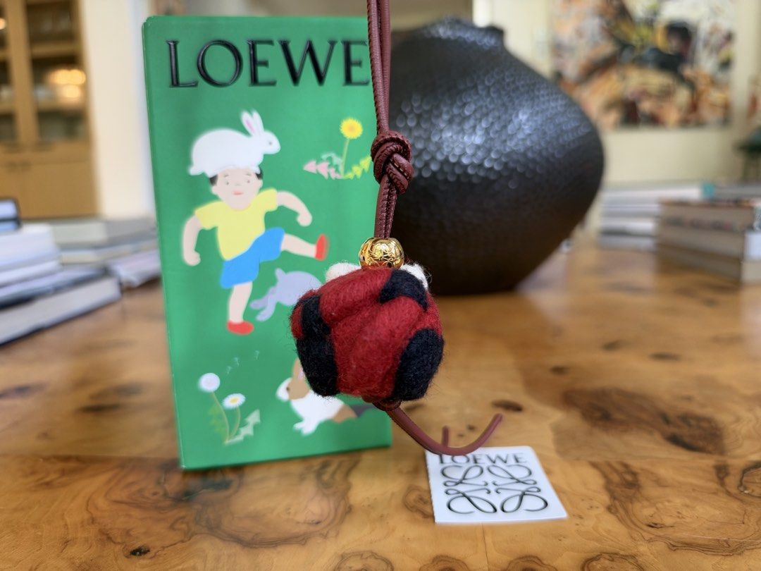 Loewe Red Panda Felt Charm (Category: Charms) located in Muntinlupa City. Submitted by katoshops (Listing ID 1469199980, Image 3). Description: Loewe Red Panda Felt Bag Charm Current Market Price: ₱29,300.00 Selling Price: ₱15,000.00 Condition: Excellent (10 /10) Reason for Selling: Bought a replacement bag charm. Don’t get to use this anymore. Additional Details: Color: Red, white, and black felt with gold hardware and reddish brown leather Worn