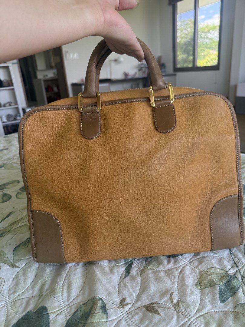 Loewe Vintage Travel Bag (Category: Luxury Bags & Wallets) located in Calamba. Submitted by mom2girls (Listing ID 1469185726, Image 3). Description: Has minor scratches from normal use, otherwise a very sturdy travel bag. Can fit the overhead cabin. The leather of this bag is so legit, you could pass it on to your grandchildren pa. No inclusions. Shipping via LBC only. SF c/o Buyer. You may book your own courier but my responsibility over the ite