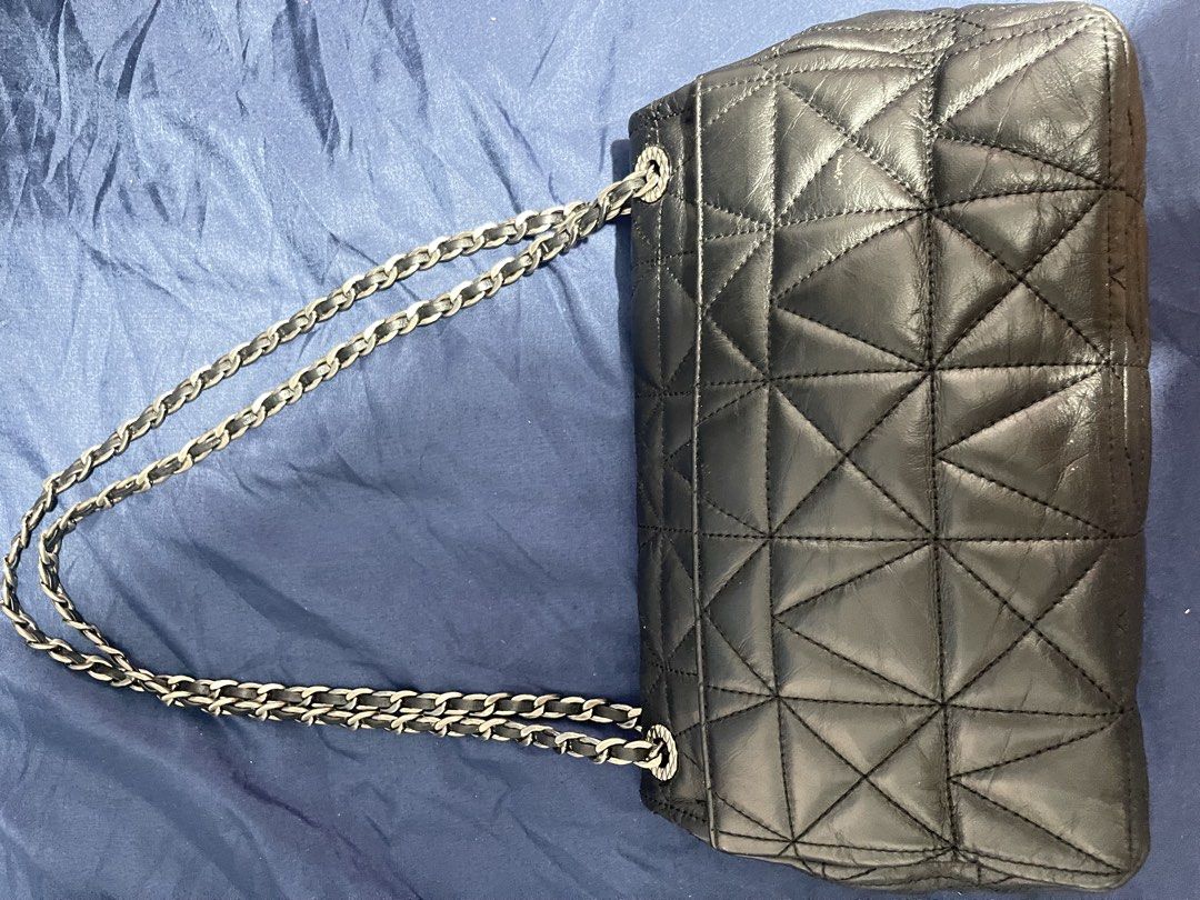 Loius Quatorze Quilted Black Leather Shoulder Bag (Category: Luxury Bags & Wallets) located in Manila. Submitted by abeline07 (Listing ID 1469296483, Image 2). Description: Black quilted leather shoulder bag . Unique triangular geometric stitching pattern across the body. Silver tone chain strap intertwined with black leather. Distinctive silver interlocking anagram turn-lock closure on the front flap. Structured rectangular shape with reinforced