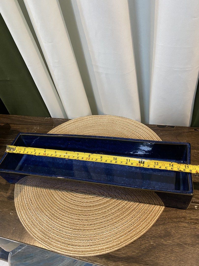 Long Blue Ceramic Rectangular Tray Decorative Dish (Category: Dinnerware & Cutlery) located in San Pedro. Submitted by jingay81 (Listing ID 1469375379, Image 2). Description: - Stunning deep blue glazed ceramic tray - Glossy finish all over with a clean surface inside and out - Dimensions: approx. 15 inches long and 4 inches high - Solid weight and premium quality - Versatile use: ideal as a table centerpiece or for organizing small items - Condi