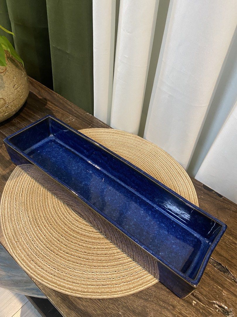 Long Blue Ceramic Rectangular Tray Decorative Dish (Category: Dinnerware & Cutlery) located in San Pedro. Submitted by jingay81 (Listing ID 1469375379, Image 1). Description: - Stunning deep blue glazed ceramic tray - Glossy finish all over with a clean surface inside and out - Dimensions: approx. 15 inches long and 4 inches high - Solid weight and premium quality - Versatile use: ideal as a table centerpiece or for organizing small items - Condi