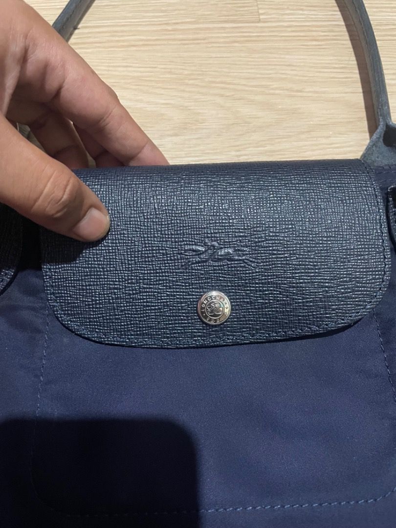Longchamp Le Pliage Navy Blue Tote Bag (Category: Luxury Bags & Wallets) located in Sorsogon. Submitted by solayram0114595 (Listing ID 1469215360, Image 2). Description: - Brand: Longchamp Le Pliage - Color: Classic Navy Blue with dark leather trim - Style: Shoulder bag with comfortable long straps - Material: Lightweight nylon body and durable leather flap/handles - Hardware: Silver-tone zipper with iconic jockey logo - Interior: Clean lining wi