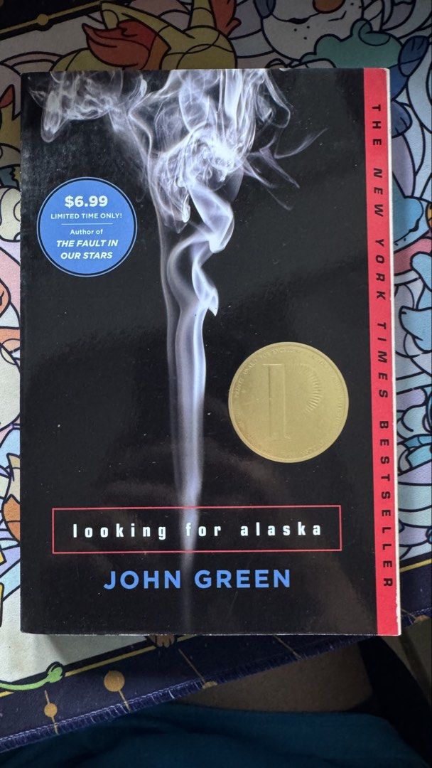 Looking for Alaska by John Green Novel Paperback (Category: Storybooks) located in Quezon City. Submitted by cc.lumberio (Listing ID 1469182989, Image 1). Description: - Title: Looking for Alaska by John Green - Edition: New York Times bestseller paperback - Cover Art: Black cover with smoke graphic - Special Feature: Printed Printz Award seal on the front - Genre: Classic contemporary young adult drama.