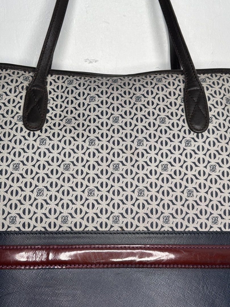 Louis Quatorze Monogram Tote Bag (Category: Luxury Bags & Wallets) located in Manila. Submitted by ekailacerna (Listing ID 1469315505, Image 2). Description: - Authentic Louis Quatorze tote bag in dark blue and white monogram canvas - Premium brown leather trim and sturdy handles - Stylish deep burgundy accent stripe with embossed gold branding - Spacious interior with a center zipped compartment, extra zip pocket, and gold metal label - Dark fab