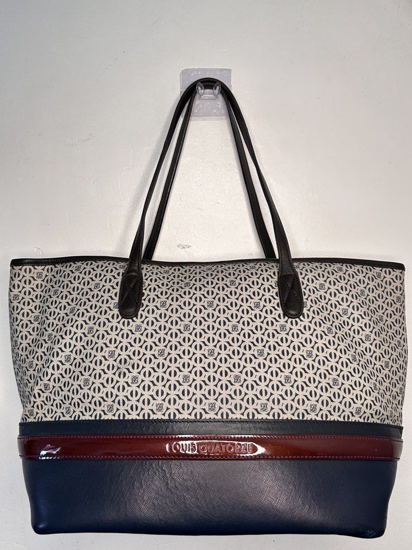 Louis Quatorze Monogram Tote Bag (Category: Luxury Bags & Wallets) located in Manila. Submitted by ekailacerna (Listing ID 1469315505, Image 1). Description: - Authentic Louis Quatorze tote bag in dark blue and white monogram canvas - Premium brown leather trim and sturdy handles - Stylish deep burgundy accent stripe with embossed gold branding - Spacious interior with a center zipped compartment, extra zip pocket, and gold metal label - Dark fab