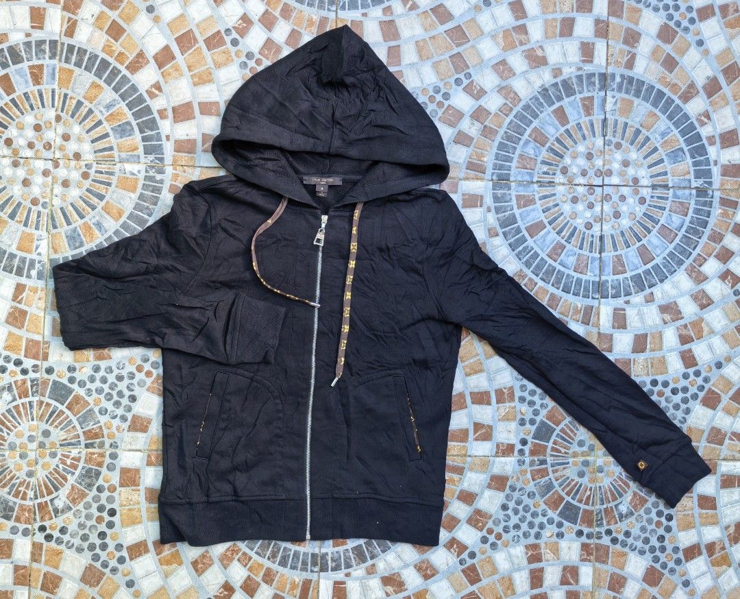Louis Vuitton Black Monogram Drawstring Zip Hoodie (Category: Hoodies) located in Quezon. Submitted by miksxthrift (Listing ID 1469276315, Image 1). Description: - Brand: Louis Vuitton - Item: Black Zip Hoodie - Size: S (Regular Fit) - Material: 80% Cotton, 20% Polyester (Made in Italy) - Design details: Monogram pattern on drawstrings, pocket linings, and inside hood - Hardware: Full metal zipper with LV pull tab - Care: Gentle dry clean only - 