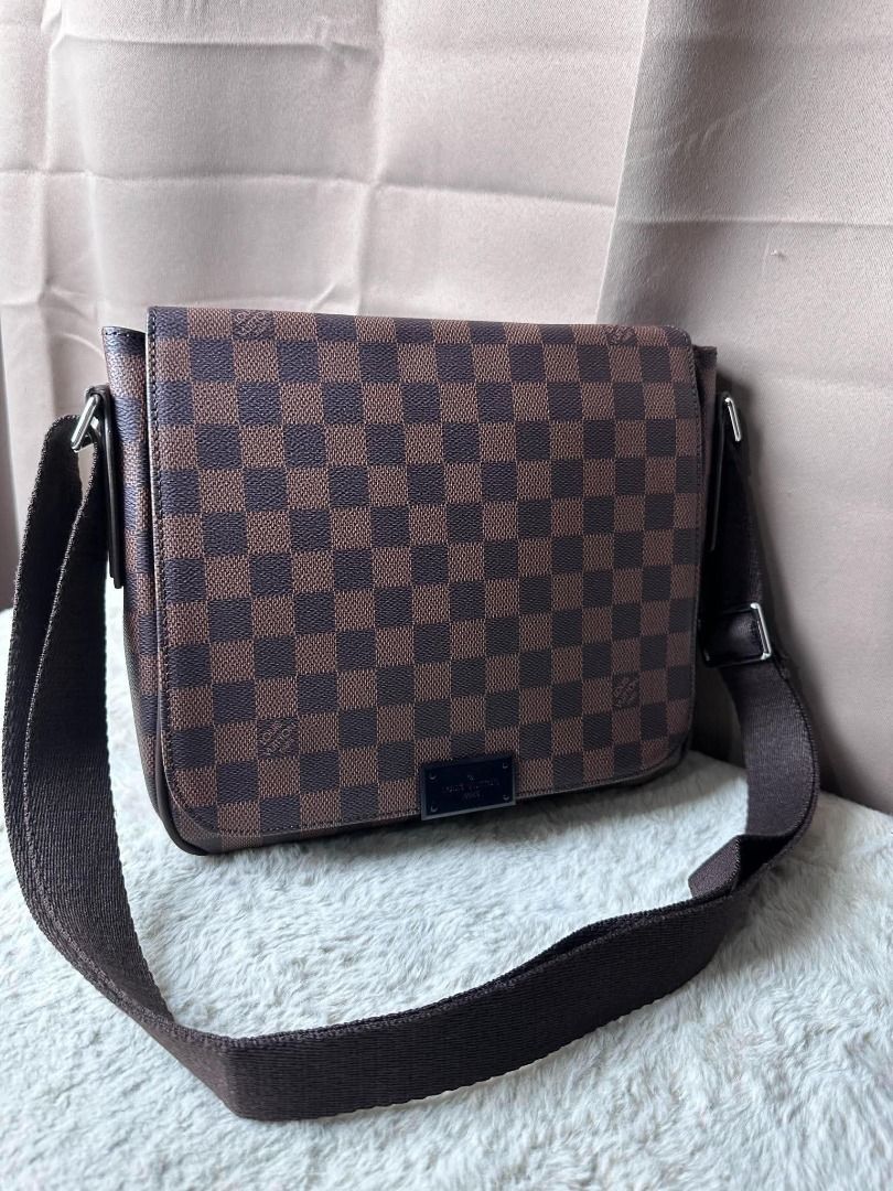 Louis Vuitton Damier Ebene Messenger Bag (Category: Luxury Bags & Wallets) located in Davao. Submitted by luckyturtle.aa6ccf (Listing ID 1469273292, Image 2). Description: - Authentic Louis Vuitton messenger bag in Damier Ebene canvas - Classic brown checkered pattern with dark brown leather trim - Adjustable canvas shoulder strap and silver-tone hardware - Clean burgundy fabric interior with Louis Vuitton Paris heat stamp - Great everyday crossb