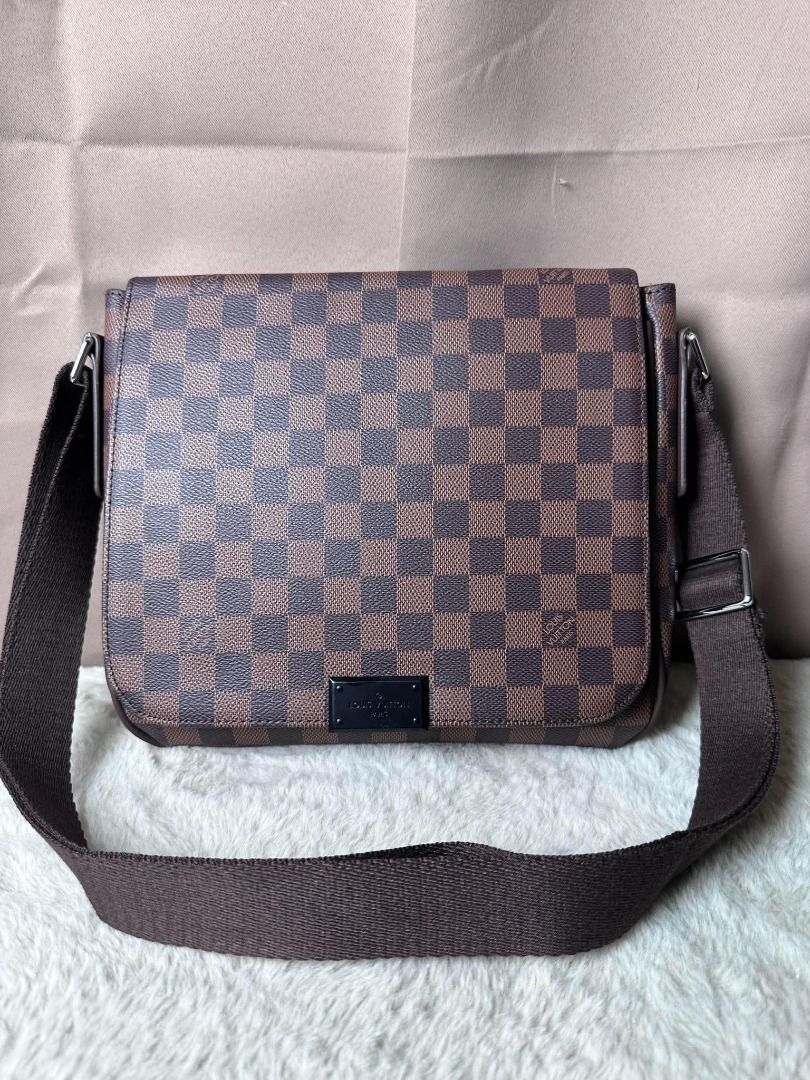 Louis Vuitton Damier Ebene Messenger Bag (Category: Luxury Bags & Wallets) located in Davao. Submitted by luckyturtle.aa6ccf (Listing ID 1469273292, Image 1). Description: - Authentic Louis Vuitton messenger bag in Damier Ebene canvas - Classic brown checkered pattern with dark brown leather trim - Adjustable canvas shoulder strap and silver-tone hardware - Clean burgundy fabric interior with Louis Vuitton Paris heat stamp - Great everyday crossb