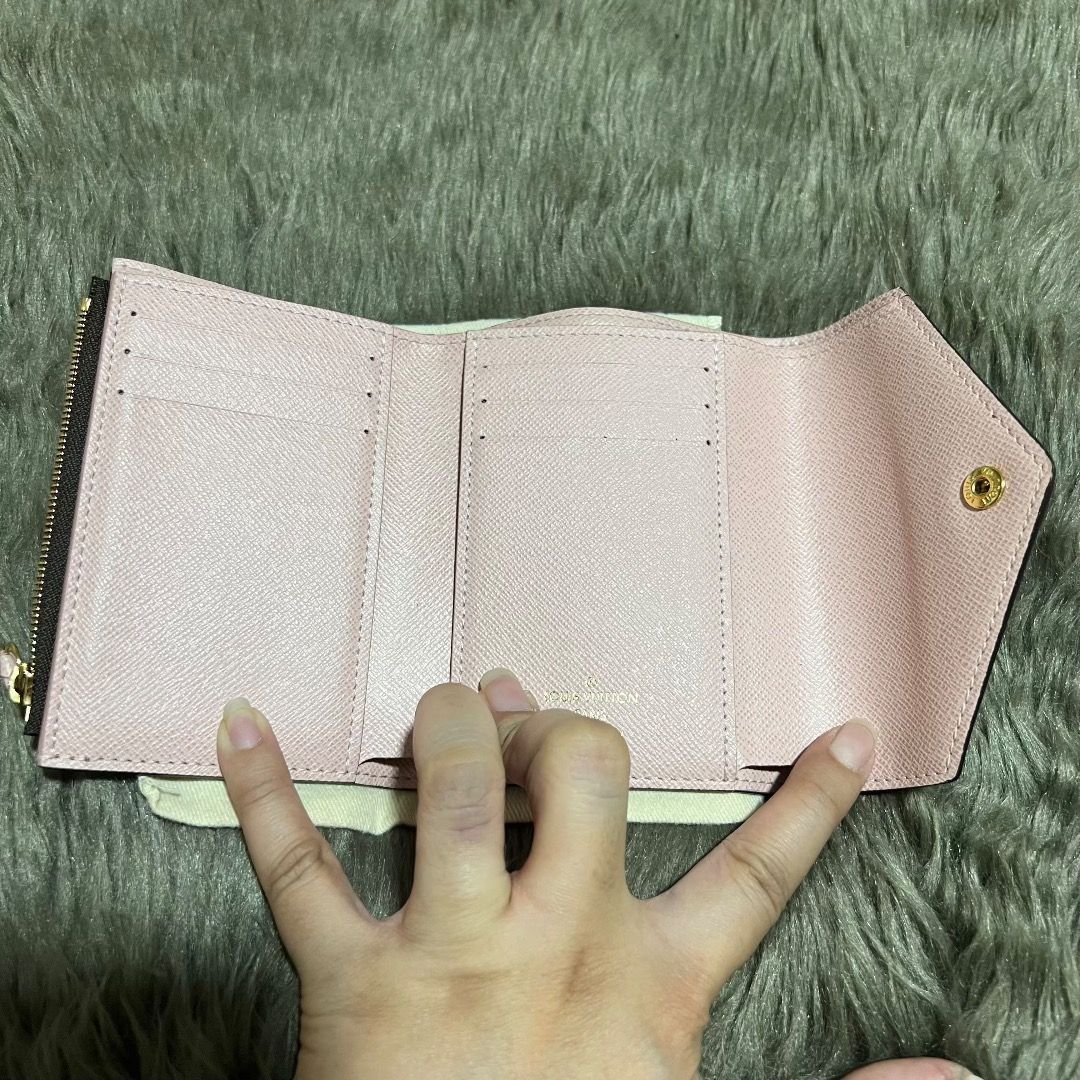 Louis Vuitton Damier Ebene Wallet (Category: Luxury Bags & Wallets) located in Quezon City. Submitted by _declutteringmom (Listing ID 1469305703, Image 2). Description: ✨ Louis Vuitton Victorine - Damier Ebene, Rose Ballerine interior ✨ 💯 guaranteed authentic 👜 Bought from LV Greenbelt ➡️ With dust bag, box, lace ➡️ Condition: lightly used; only flaw is the front button 💰 Mode of payment: BPI, GCash, GoTyme.