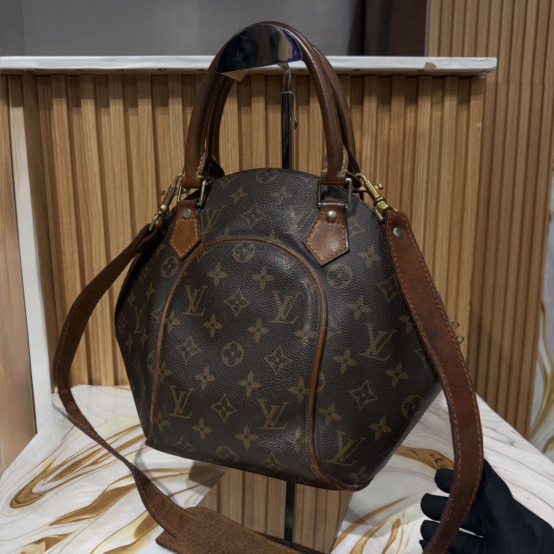 Louis Vuitton Monogram Canvas Handbag (Category: Shoulder Bags) located in Bambang. Submitted by heats777 (Listing ID 1469170545, Image 2). Description: - Authentic Louis Vuitton monogram canvas handbag - Classic structured dome shape with a convenient front pocket - Beautiful brown leather handles and adjustable long strap included - Elegant gold-tone hardware accents - Spacious and great for everyday use - Clean interior lining - Condition: Min