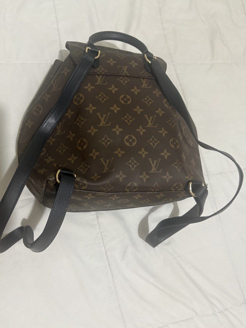 Louis Vuitton Monogram Canvas Backpack (Category: Luxury Bags & Wallets) located in Manila. Submitted by nykji96 (Listing ID 1469191182, Image 3). Description: - Authentic Louis Vuitton monogram canvas backpack - Stylish black leather straps and trim with gold-tone hardware - Secure drawstring closure with front buckle flap - Convenient exterior front zip pocket - Luxurious deep burgundy interior lining - Stamped Louis Vuitton Paris, Made in Fran
