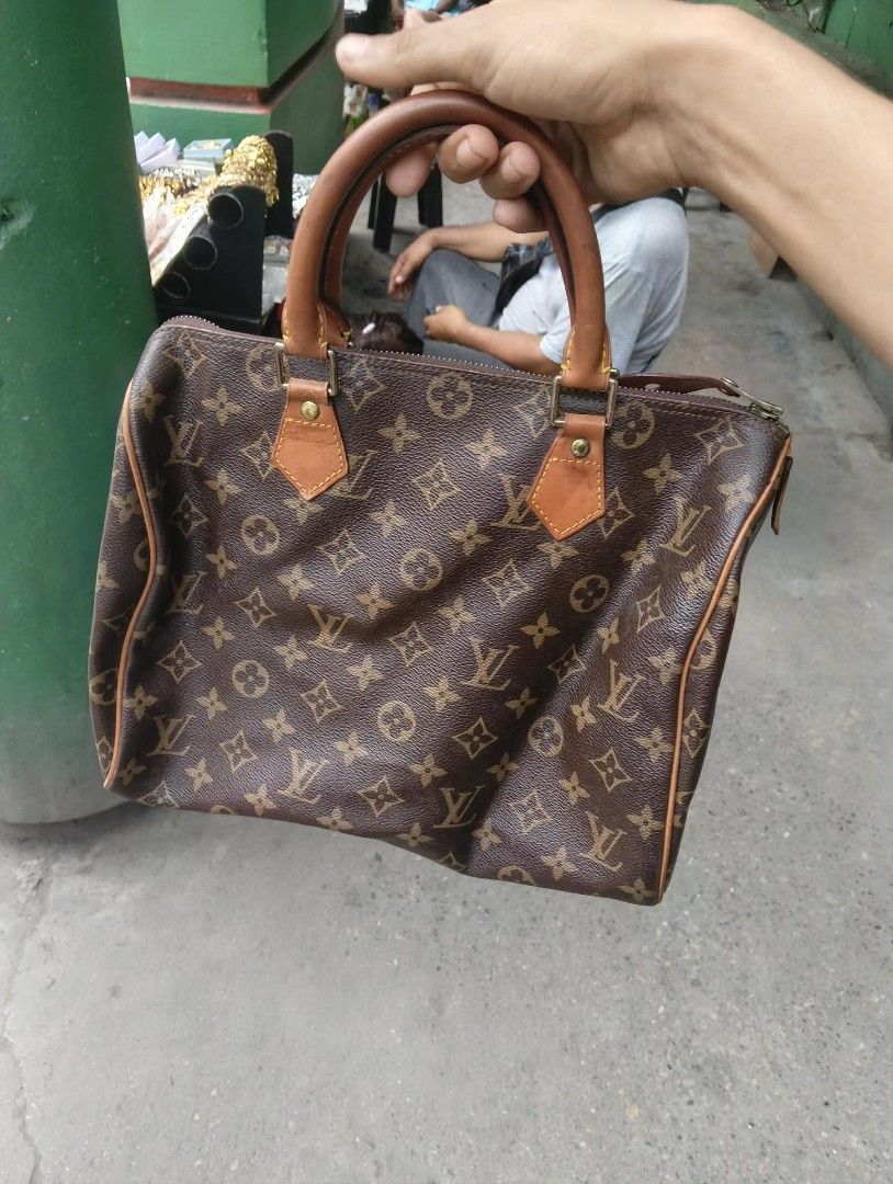 Louis Vuitton Monogram Canvas Speedy Handbag (Category: Luxury Bags & Wallets) located in Zamboanga. Submitted by nurjim_hajim (Listing ID 1469212401, Image 2). Description: - Authentic Louis Vuitton Monogram Canvas Handbag - Classic brown and tan colorway with a chic, structured shape - Features durable Vachetta leather top handles and trim - Secure zip-top closure to keep your daily essentials safe - Roomy interior fits phone, wallet, keys, and