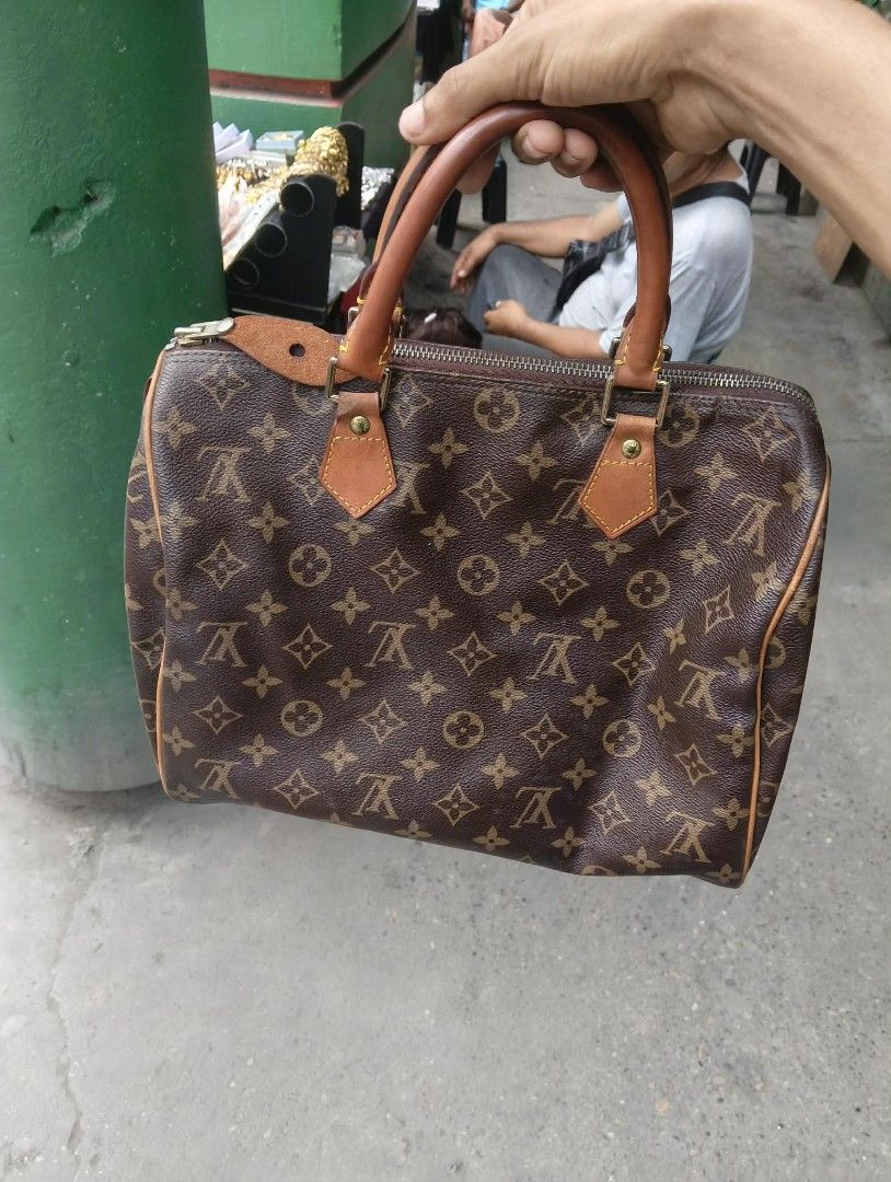 Louis Vuitton Monogram Canvas Speedy Handbag (Category: Luxury Bags & Wallets) located in Zamboanga. Submitted by nurjim_hajim (Listing ID 1469212401, Image 1). Description: - Authentic Louis Vuitton Monogram Canvas Handbag - Classic brown and tan colorway with a chic, structured shape - Features durable Vachetta leather top handles and trim - Secure zip-top closure to keep your daily essentials safe - Roomy interior fits phone, wallet, keys, and