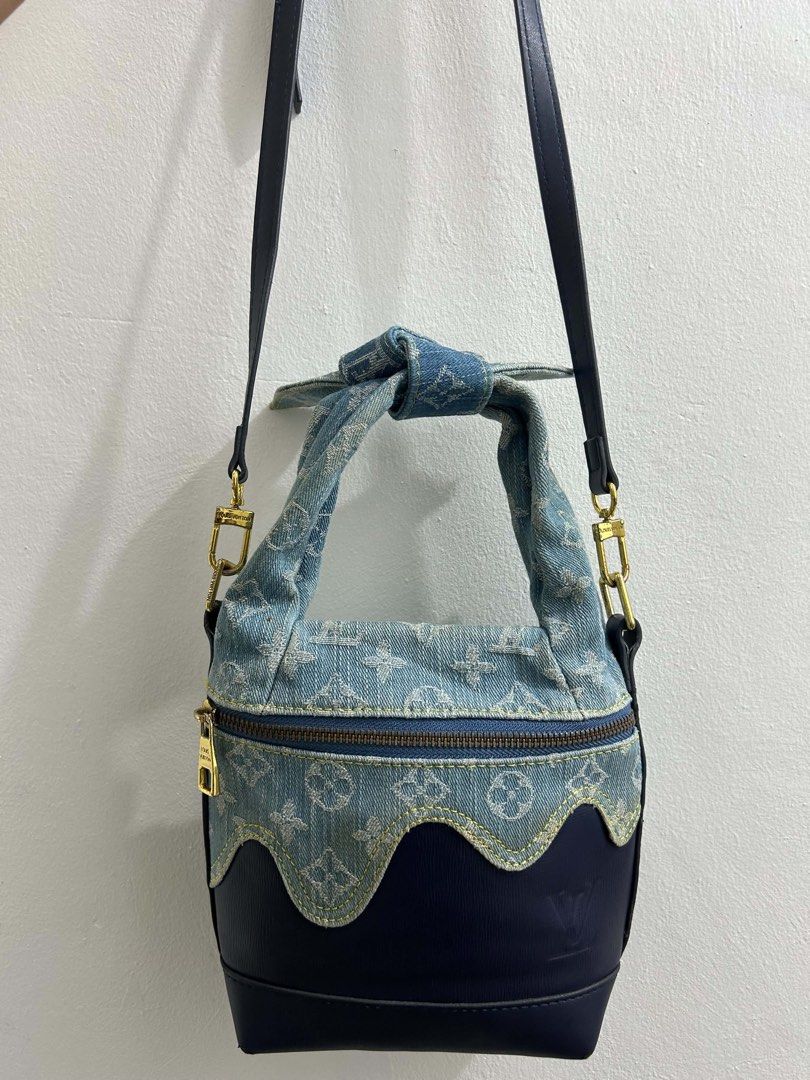 Louis Vuitton Monogram Denim and Leather Handbag (Category: Luxury Bags & Wallets) located in Manila. Submitted by yummy245 (Listing ID 1469201135, Image 1). Description: - Brand: Louis Vuitton - Material: Blue monogram denim and dark leather with scalloped trim - Hardware: Gold-tone - Closure: Front zipper - Handles: Knotted top handle and detachable black shoulder strap - Interior: Light fabric lining with LV Paris made in France leather tag - 