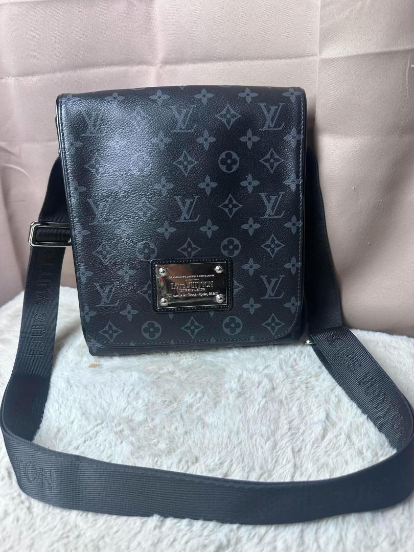 Louis Vuitton Monogram Eclipse Messenger Bag (Category: Luxury Bags & Wallets) located in Davao. Submitted by luckyturtle.aa6ccf (Listing ID 1469274031, Image 3). Description: - Authentic Louis Vuitton Monogram Eclipse Messenger Bag - Classic black and grey colorway - Adjustable canvas strap with branded detailing - Front flap accented with Louis Vuitton Inventeur Paris metal plaque - Clean interior featuring fabric lining and Made in France leat
