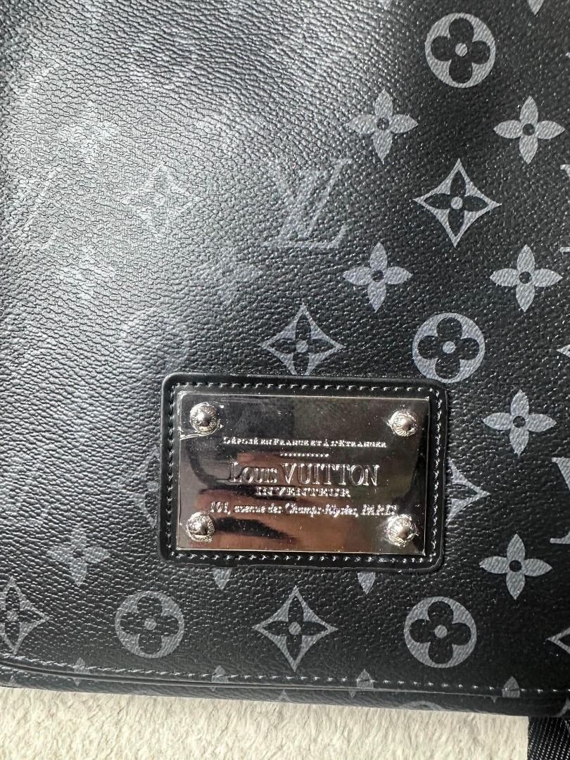 Louis Vuitton Monogram Eclipse Messenger Bag (Category: Luxury Bags & Wallets) located in Davao. Submitted by luckyturtle.aa6ccf (Listing ID 1469274031, Image 2). Description: - Authentic Louis Vuitton Monogram Eclipse Messenger Bag - Classic black and grey colorway - Adjustable canvas strap with branded detailing - Front flap accented with Louis Vuitton Inventeur Paris metal plaque - Clean interior featuring fabric lining and Made in France leat