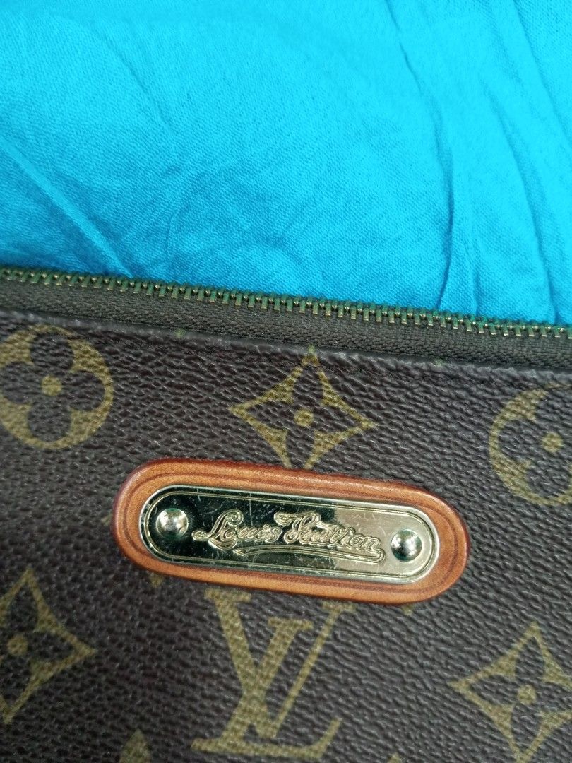 Louis Vuitton Monogram Pochette Accessories Handbag (Category: Luxury Bags & Wallets) located in Bacolod City. Submitted by exequelgra46775 (Listing ID 1469178078, Image 2). Description: - Louis Vuitton monogram canvas with rich brown trim - Elegant gold-tone hardware and engraved metal front plate - Convenient chain strap for easy carrying - Secure zip-top closure with branded leather pull tab - Clean brown textile interior featuring the officia