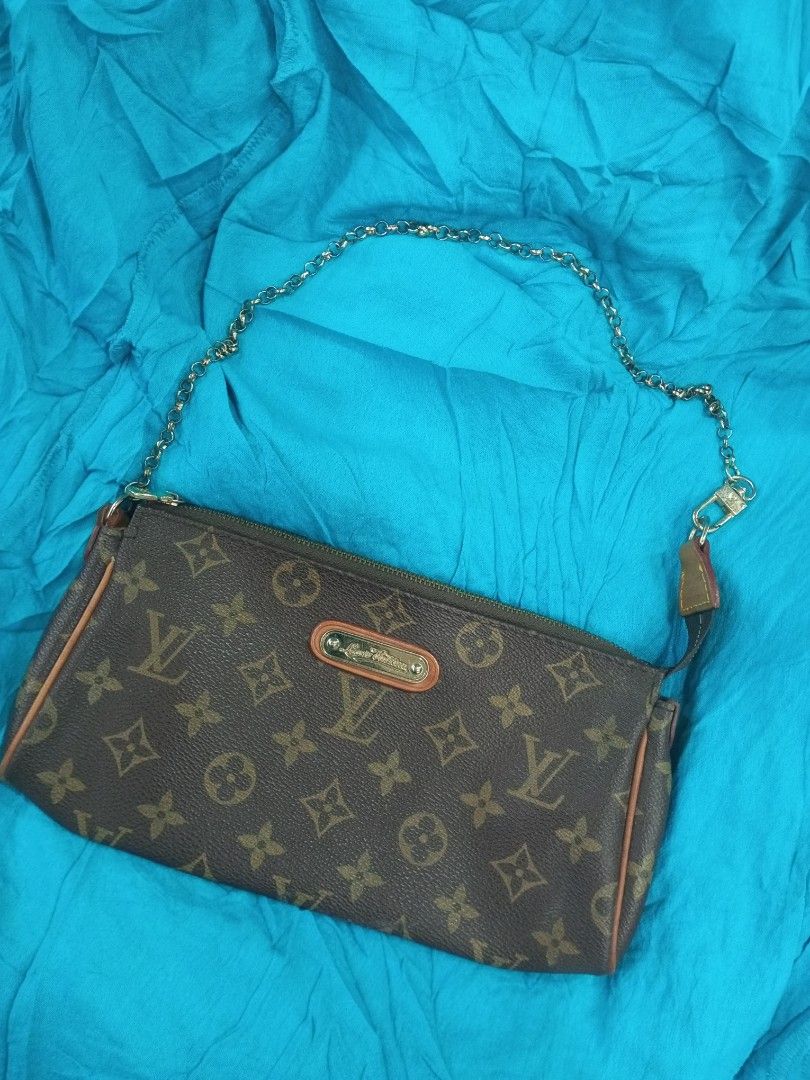 Louis Vuitton Monogram Pochette Accessories Handbag (Category: Luxury Bags & Wallets) located in Bacolod City. Submitted by exequelgra46775 (Listing ID 1469178078, Image 1). Description: - Louis Vuitton monogram canvas with rich brown trim - Elegant gold-tone hardware and engraved metal front plate - Convenient chain strap for easy carrying - Secure zip-top closure with branded leather pull tab - Clean brown textile interior featuring the officia