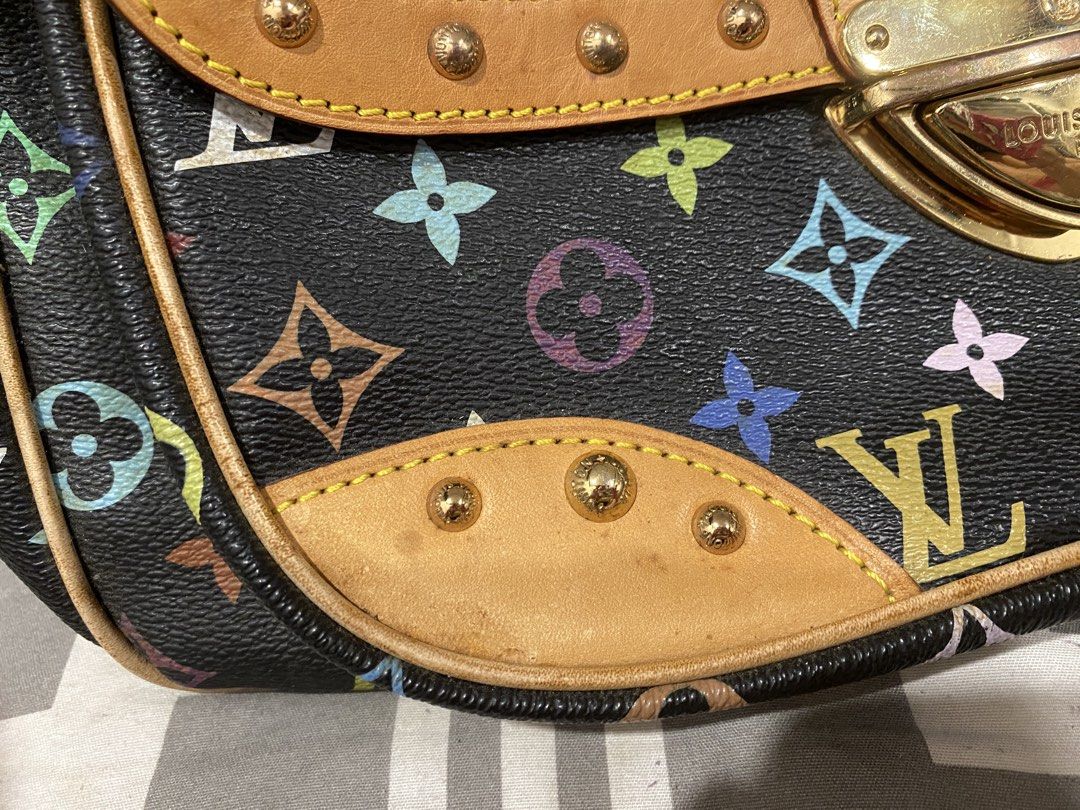 Louis Vuitton Multicolore Black Handbag (Category: Luxury Bags & Wallets) located in Muntinlupa City. Submitted by mj.finds (Listing ID 1469257057, Image 3). Description: - Brand: Louis Vuitton - Material: Black Multicolore Monogram Canvas with Vachetta leather trim - Hardware: Gold-tone with engraved branding and brass studs - Closure: Secure front clasp closure - Handles: Double top handles for easy carrying - Interior: Grey lining with stamped