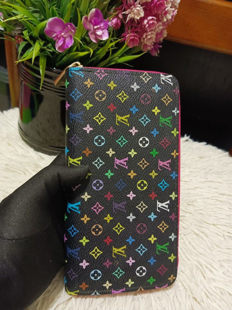 Louis Vuitton Multicolour Monogram Zippy Wallet (Category: Luxury Bags & Wallets) located in Digos. Submitted by chihanu (Listing ID 1469196984, Image 1). Description: - Louis Vuitton Zippy Wallet - Black canvas with iconic multicolour monogram print - Vibrant bright pink interior lining and matching pink zipper fabric - Secure gold-tone zip-around hardware - Multiple card slots, slip compartments, and accordion gussets for easy organization - Be