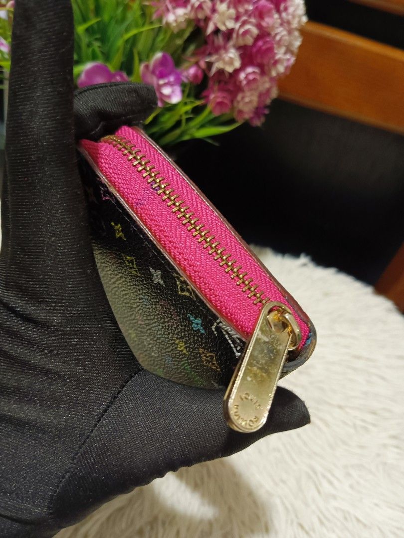 Louis Vuitton Multicolour Monogram Zippy Wallet (Category: Luxury Bags & Wallets) located in Digos. Submitted by chihanu (Listing ID 1469196984, Image 3). Description: - Louis Vuitton Zippy Wallet - Black canvas with iconic multicolour monogram print - Vibrant bright pink interior lining and matching pink zipper fabric - Secure gold-tone zip-around hardware - Multiple card slots, slip compartments, and accordion gussets for easy organization - Be