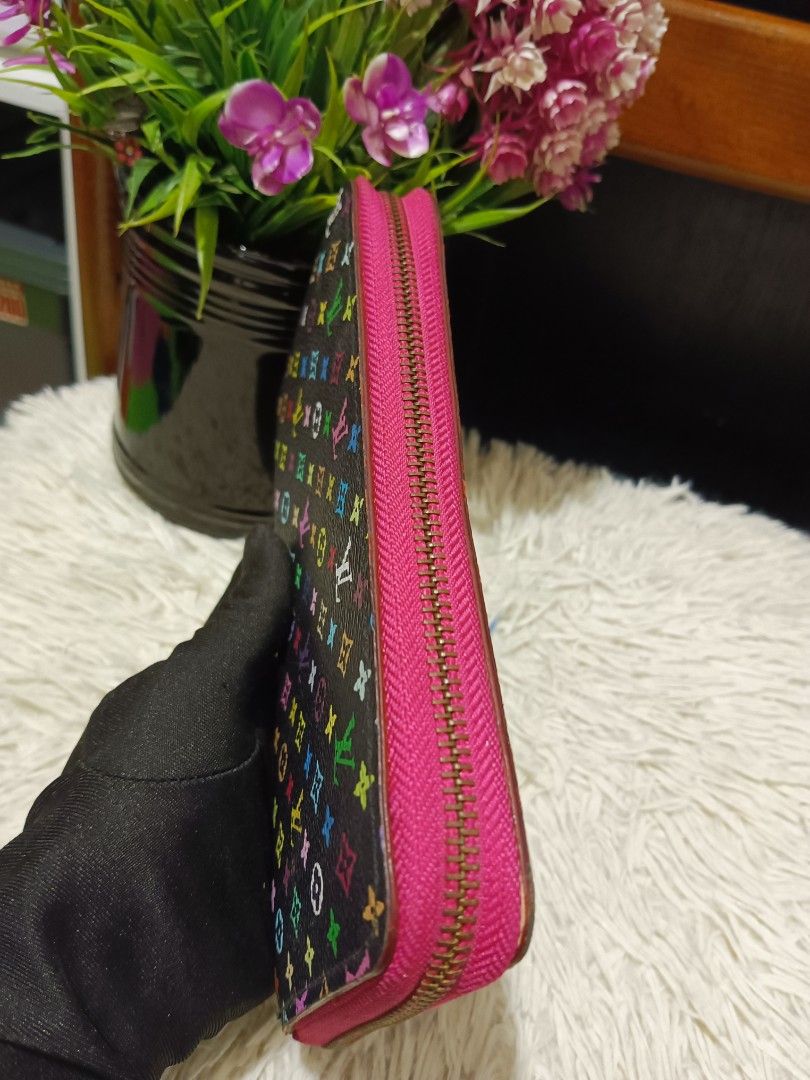 Louis Vuitton Multicolour Monogram Zippy Wallet (Category: Luxury Bags & Wallets) located in Digos. Submitted by chihanu (Listing ID 1469196984, Image 2). Description: - Louis Vuitton Zippy Wallet - Black canvas with iconic multicolour monogram print - Vibrant bright pink interior lining and matching pink zipper fabric - Secure gold-tone zip-around hardware - Multiple card slots, slip compartments, and accordion gussets for easy organization - Be