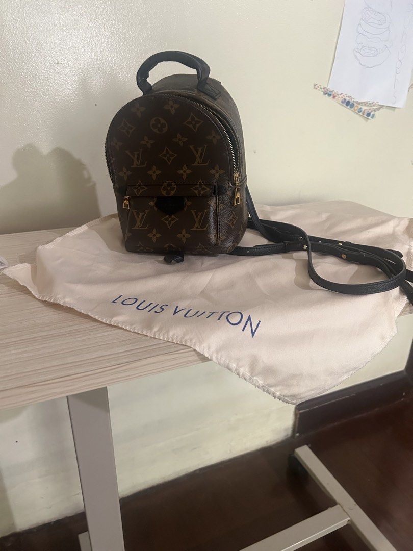 Louis Vuitton Palm Springs Mini Backpack Monogram (Category: Luxury Bags & Wallets) located in Cebu City. Submitted by serene_simplicity (Listing ID 1469194361, Image 1). Description: - “OG quality” Monogram coated canvas with luxurious black leather trim - Hardware: Elegant gold-tone hardware - Versatile Carry: Includes a top handle and multiple adjustable straps - Storage: Convenient front zipped pocket for quick-access items - Inclusions: Come
