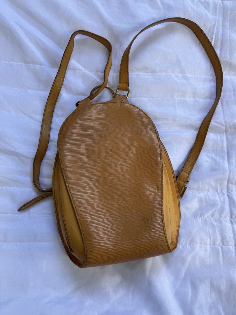 Louis Vuitton Yellow Epi Leather Mabillon Backpack (Category: Luxury Bags & Wallets) located in Quezon City. Submitted by rizza14ortiz (Listing ID 1469178134, Image 1). Description: vibrant yellow leather Epi leather - Features a structured silhouette with classic gold-tone hardware - Adjustable shoulder straps for a comfortable, customizable fit - Convenient vertical zippered pocket located on the back - Subtle LV initials stamped neatly near th