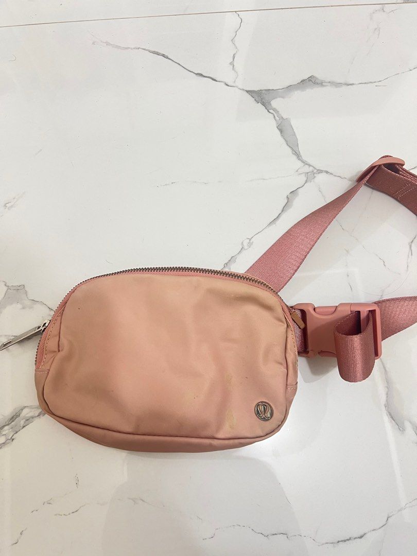 Lululemon Everyday Belt Bag Pink Pastel (Category: Cross-body Bags) located in Antipolo. Submitted by luxurieslvoes (Listing ID 1469201471, Image 1). Description: - Authentic Lululemon Everyday Belt Bag - Color: Soft pink - Features a zippered main compartment and secure back zip pocket - Adjustable strap with convenient side-release buckle - Signature Lululemon logo hardware - Condition: Has minor spots and marks on the front fabric (priced acco