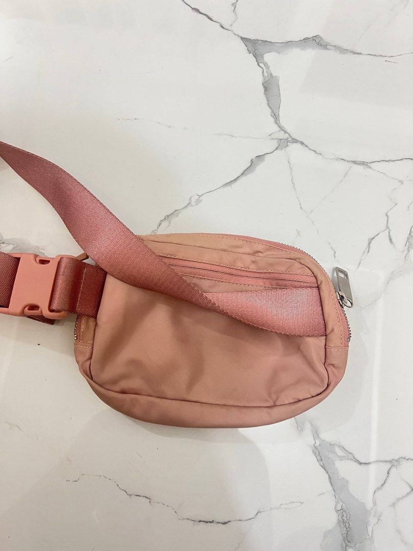 Lululemon Everyday Belt Bag Pink Pastel (Category: Cross-body Bags) located in Antipolo. Submitted by luxurieslvoes (Listing ID 1469201471, Image 2). Description: - Authentic Lululemon Everyday Belt Bag - Color: Soft pink - Features a zippered main compartment and secure back zip pocket - Adjustable strap with convenient side-release buckle - Signature Lululemon logo hardware - Condition: Has minor spots and marks on the front fabric (priced acco