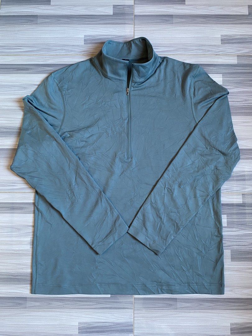 Lululemon Metal Vent Tech 1/2 Zip Pullover (Category: Activewear) located in Bayambang. Submitted by vintagestuffph (Listing ID 1469199380, Image 1). Description: - Brand: Lululemon - Style: Half-zip pullover with stand-up collar - Color: Muted blue-grey - Size: S (tag intact) - Material: Recycled polyester and elastane blend for comfortable stretch - Details: Small reflective logo on the lower back hem.