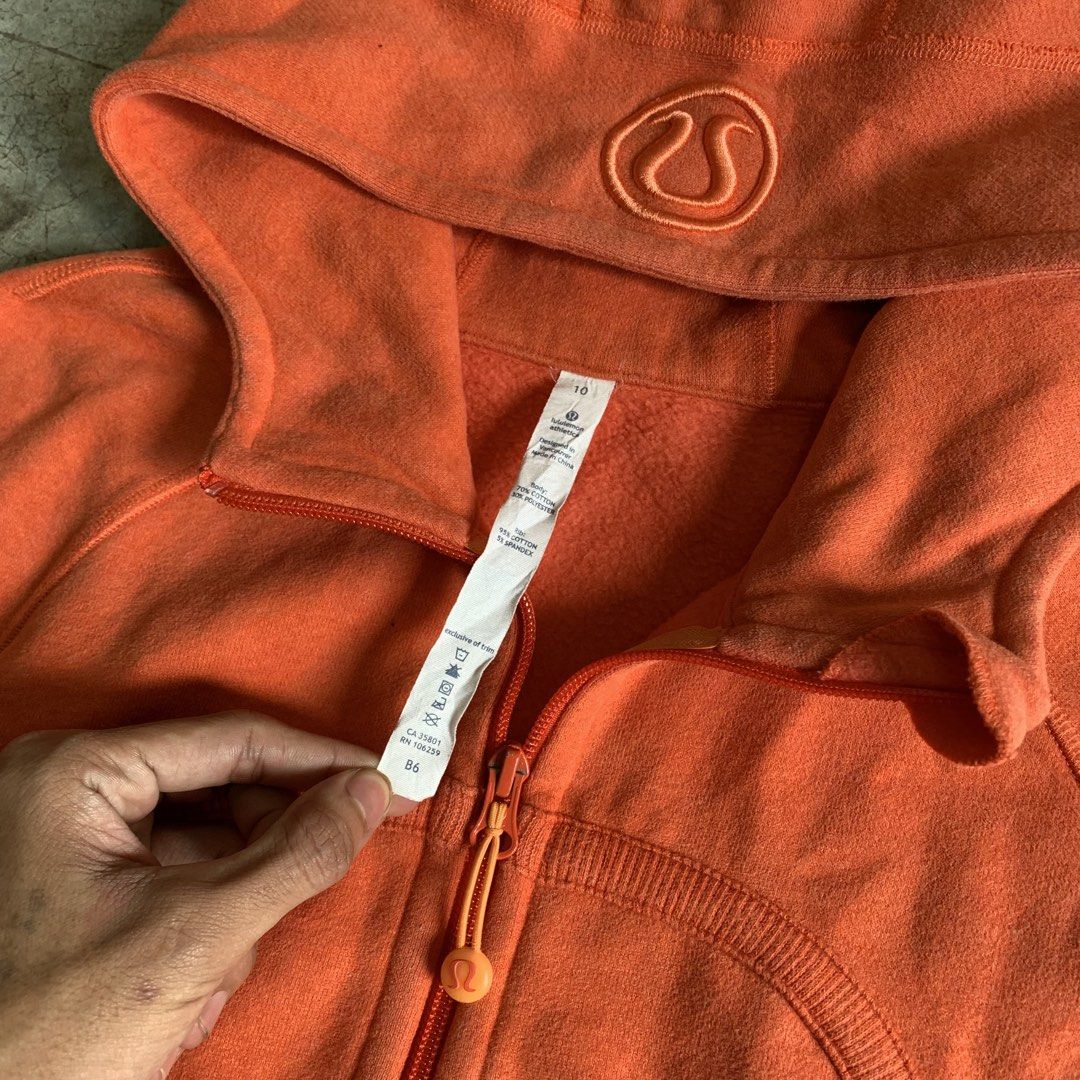 Lululemon Orange Full Zip Hoodie Size 10 (Category: Coats, Jackets and Outerwear) located in Manila. Submitted by emplysthrift. (Listing ID 1469224931, Image 3). Description: Lululemon Orange Full Zip Hoodie Size 10 Width "19.9 Length "26 Excellent Condition Colorrate: 9.5/10 Flaws: none Unli vouch/vc for safe transactions 📲 Location: Laspinas City, Metro Manila, Brngy Talon Uno. 📍 DM IF INTERESTED📥 - Brand: Lululemon - Style: Classic Scuba Fu