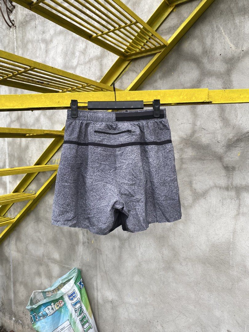 Lululemon Running Short (Category: Shorts) located in Lucena. Submitted by handpickthrift (Listing ID 1469285673, Image 3). Description: - Brand: Lululemon Size 28-32 Above the knee - Color: Heathered Grey - Condition: Excellent - Built-in liner for extra comfort and support - Adjustable drawstring waist for a secure fit - Convenient back zipper pocket for small essentials - Reflective logo near the hem for low-light visibility - Lightweight, str