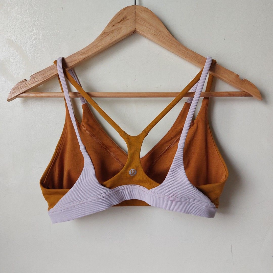 Lululemon Sports bra l (Category: Activewear) located in Quezon City. Submitted by lovedcollection_2020 (Listing ID 1469166457, Image 2). Description: - Brand: Lululemon - Features: Includes pad slots for customizable support - Condition: Well maintained, with a minor pinkish color transfer spot on the ribbed back band near the stitching.